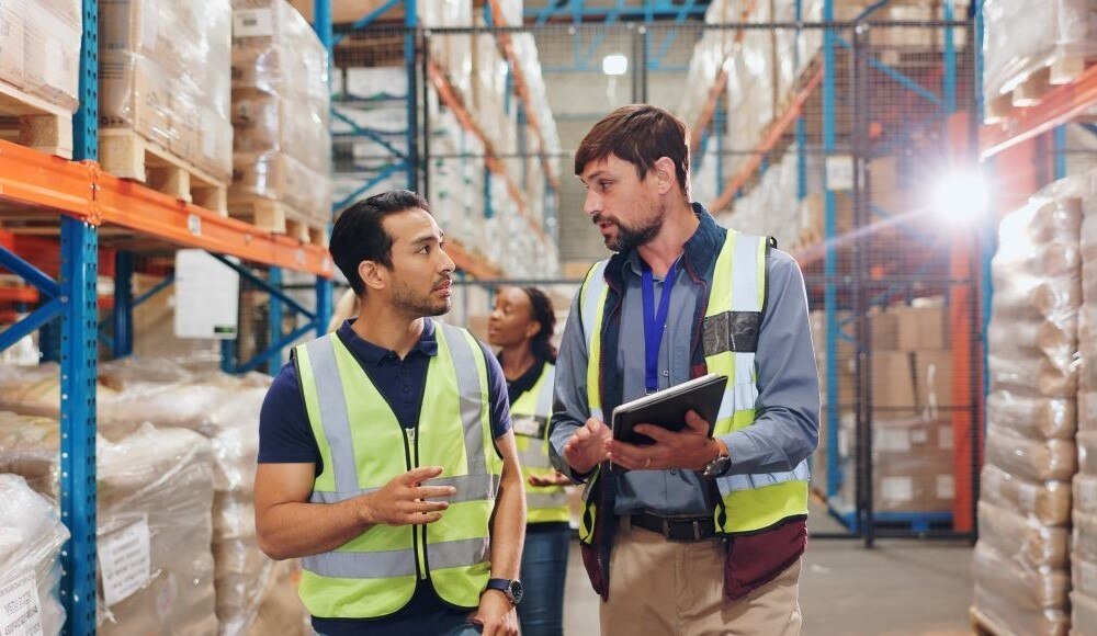 Employees walking around a warehouse in a training setting
