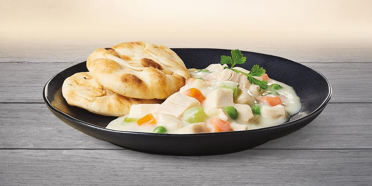 Casserole of Chicken and Vegetables in White Sauce with Feta and Naan Bread