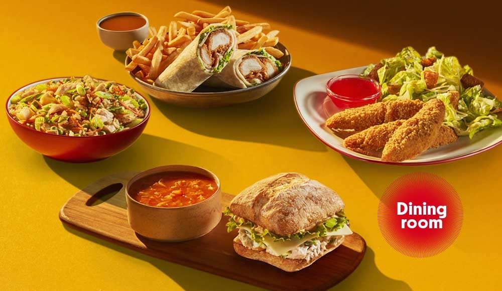 4 lunch meals on a table in a St-Hubert restaurant