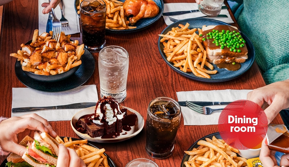 Several St-Hubert Classic Meals on a table