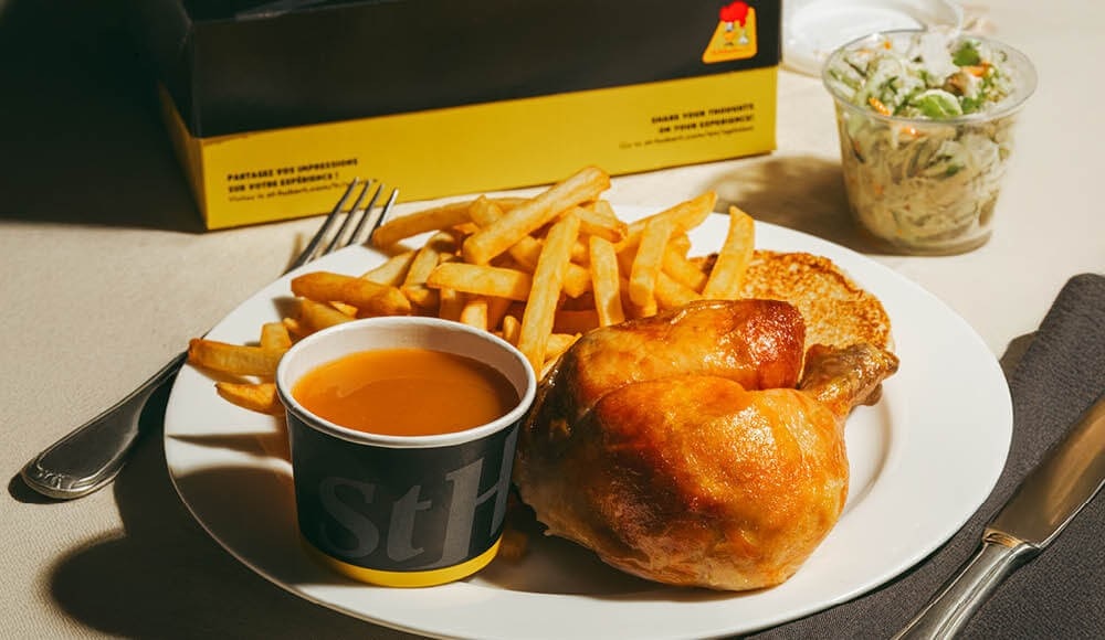 Quarter leg meal with fries, a bun, coleslaw and BBQ sauce.