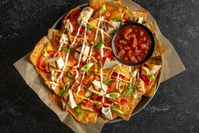 A delicious appetizer of 6 chicken wings and a pint,the Mixed Platter, nachos or 12 chicken wings, served with 2 pints of beer.