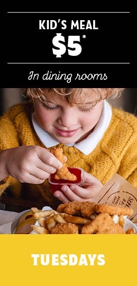 Kid eating nuggets