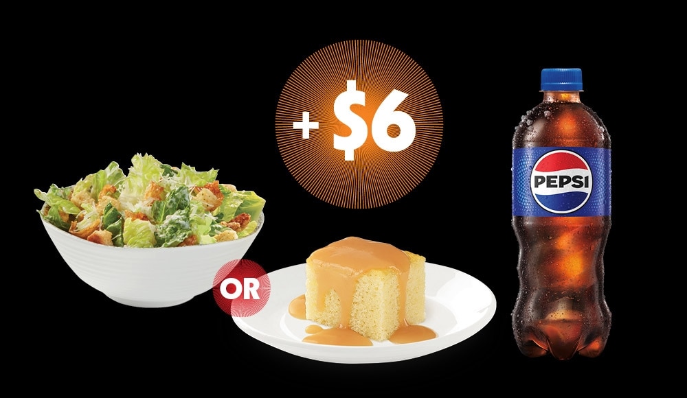 A white vanilla cake topped with sucre à la crème sauce, a caesar salad, and a bottle of Pepsi.