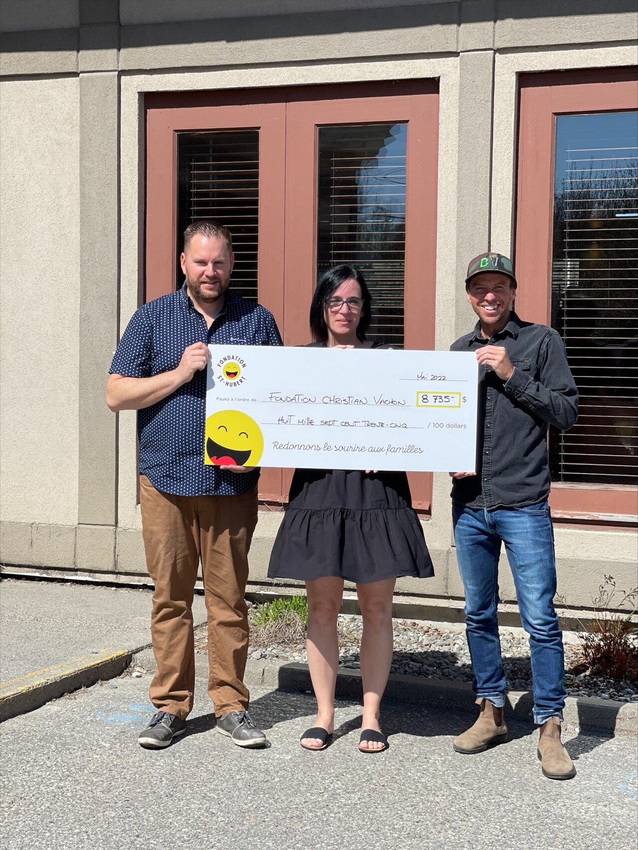 Group of people holding a check for the Christian Vachon Foundation