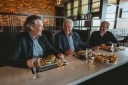 Louis, Pierre and Jean having dinner together in one of their restaurants