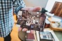 Michel showing an old photo of him in the kitchen