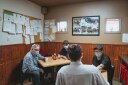 Michel with employees in the break room