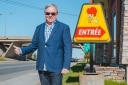 Michel Rochon outside, in the entrance of his restaurant