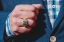 Michel showing his custom ring, which he wears on the ring finger of his right hand